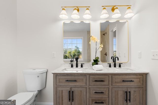 bathroom featuring toilet and vanity