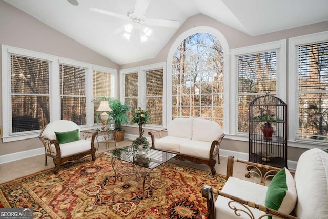 sunroom featuring ceiling fan and vaulted ceiling