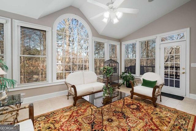 sunroom featuring ceiling fan and vaulted ceiling