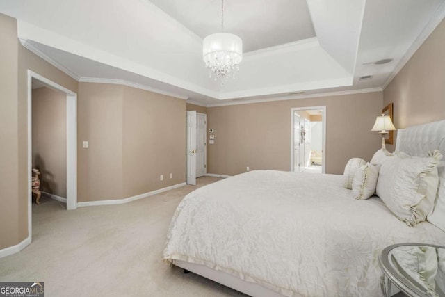 carpeted bedroom featuring a tray ceiling and crown molding