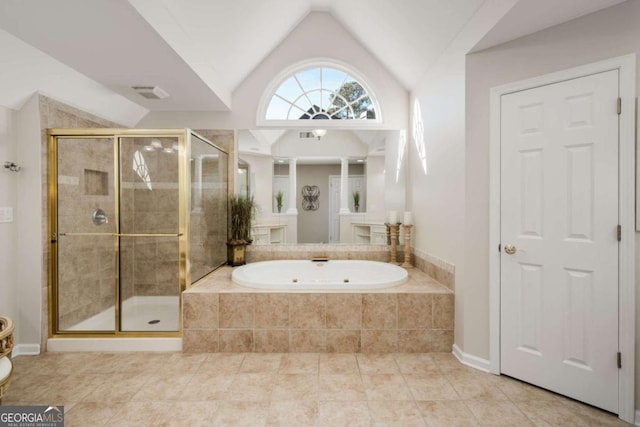 bathroom with lofted ceiling and independent shower and bath