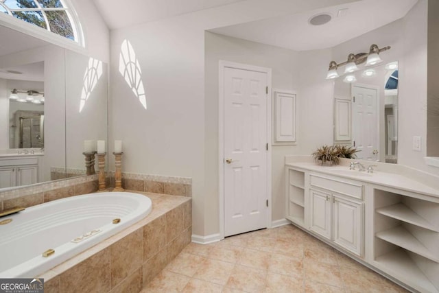 bathroom with tile patterned floors, vanity, and shower with separate bathtub