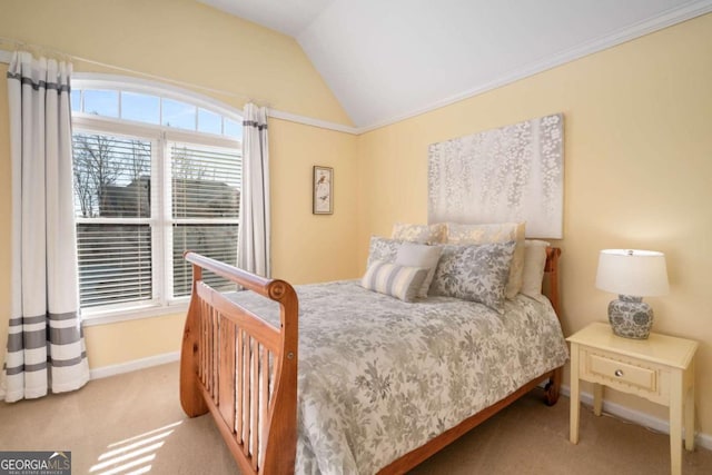 bedroom with vaulted ceiling and light carpet