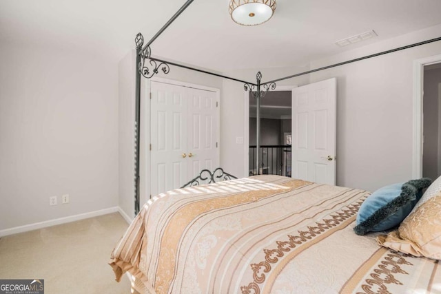 bedroom with a closet and carpet floors