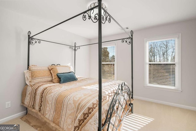 bedroom featuring light carpet