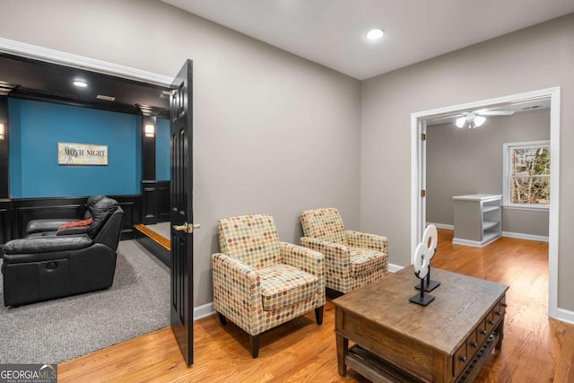 sitting room featuring ceiling fan and hardwood / wood-style floors