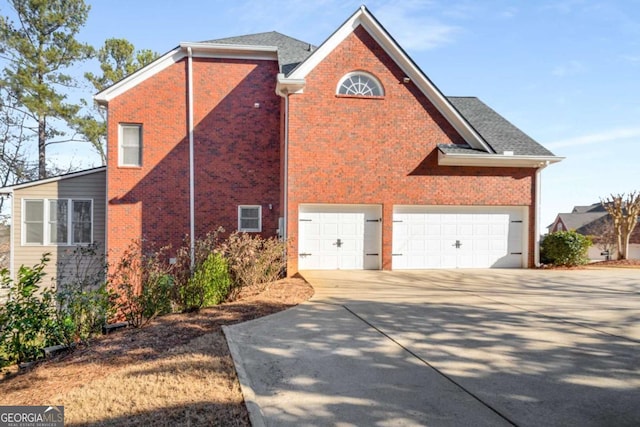 view of side of property with a garage