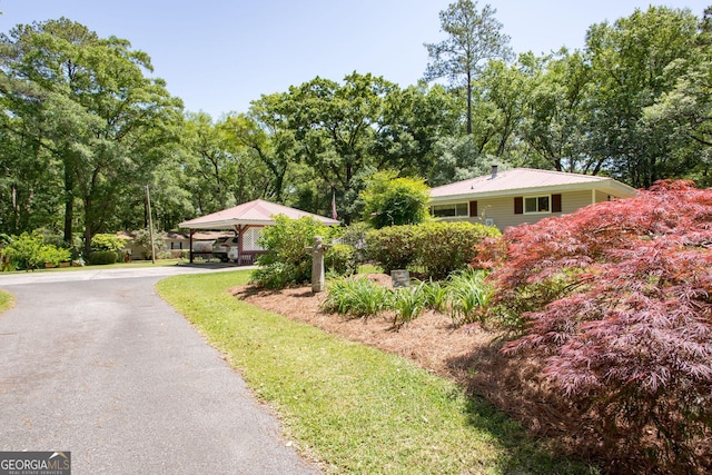 exterior space with a carport