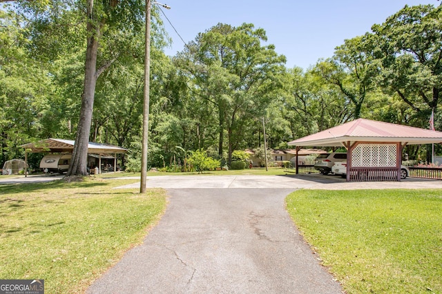 view of property's community with a yard