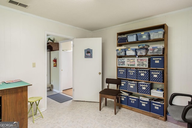 sitting room featuring crown molding