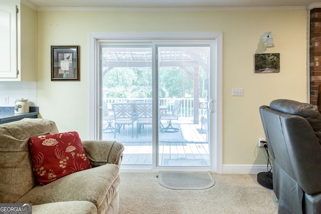 entryway with light colored carpet, crown molding, and a healthy amount of sunlight