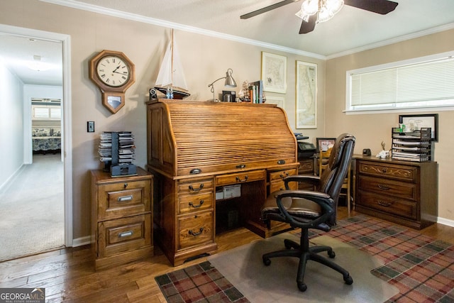 office area with ceiling fan, crown molding, and dark wood-type flooring