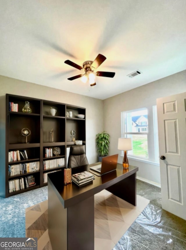 office space with ceiling fan