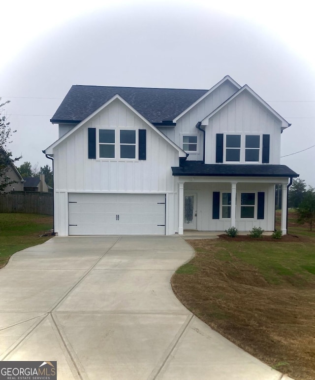 view of front facade with a front yard and a garage