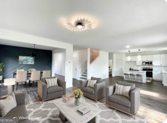 living room featuring an inviting chandelier