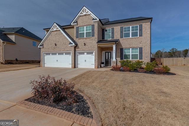 view of front of home featuring a garage and a front lawn