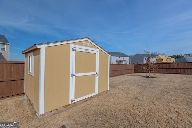 view of outbuilding with a lawn