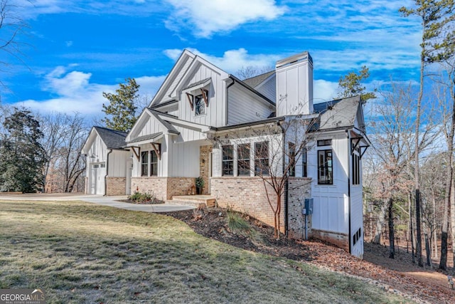 view of home's exterior featuring a yard and a garage