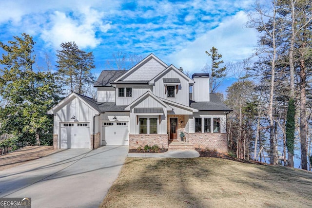 view of front of property with a front lawn and a garage