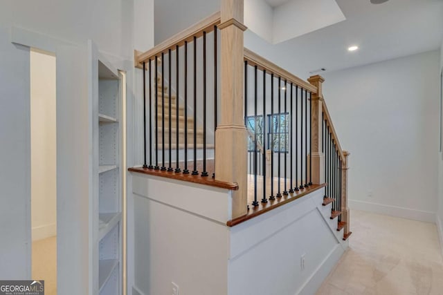 stairway featuring carpet floors