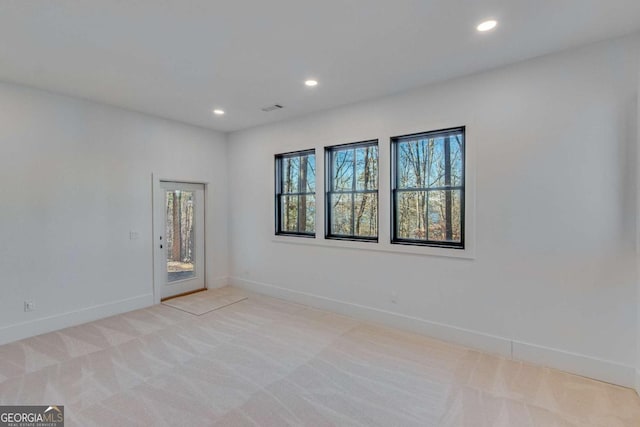 carpeted empty room featuring a healthy amount of sunlight