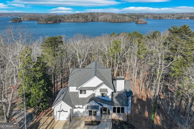 drone / aerial view with a water view