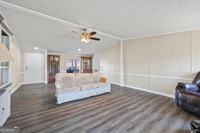 unfurnished living room with lofted ceiling, a textured ceiling, ceiling fan, and dark hardwood / wood-style floors