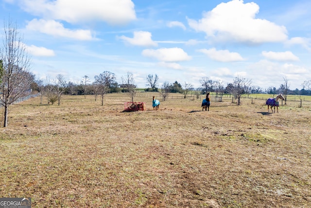 exterior space with a lawn and a rural view