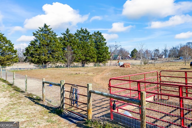 view of yard with a rural view