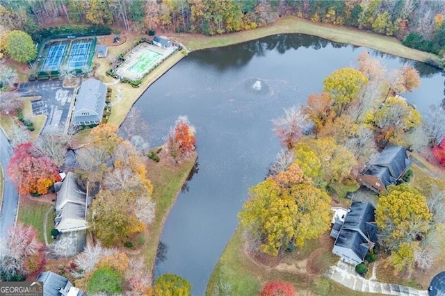 birds eye view of property with a water view