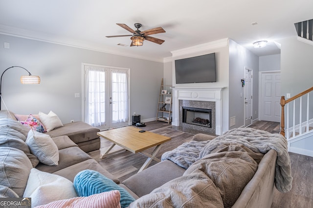 living room featuring ceiling fan, french doors, crown molding, and hardwood / wood-style flooring