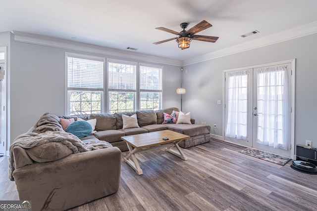 living room featuring french doors, ceiling fan, crown molding, and hardwood / wood-style floors