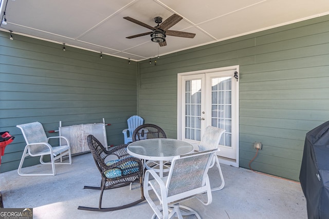 view of patio featuring ceiling fan and french doors