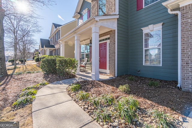 entrance to property featuring a porch