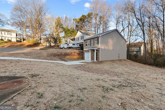 view of property exterior with a garage