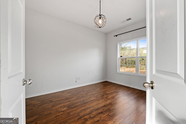 unfurnished room with dark hardwood / wood-style floors