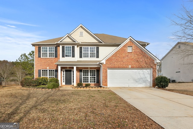 view of front of house with a front lawn and a garage