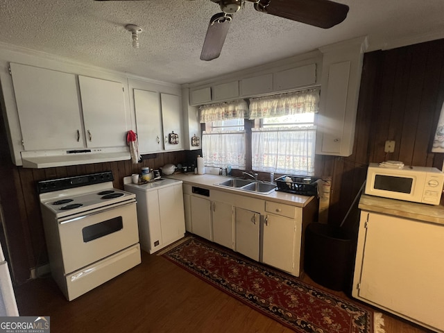 kitchen featuring white appliances, white cabinetry, a textured ceiling, and sink