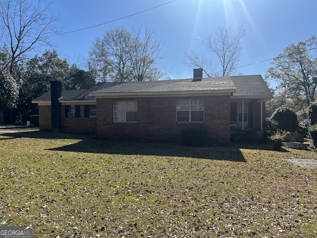 back of house with a yard