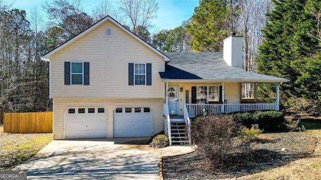 view of front of house with covered porch and a garage