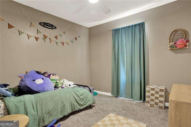 bedroom featuring ceiling fan and carpet flooring