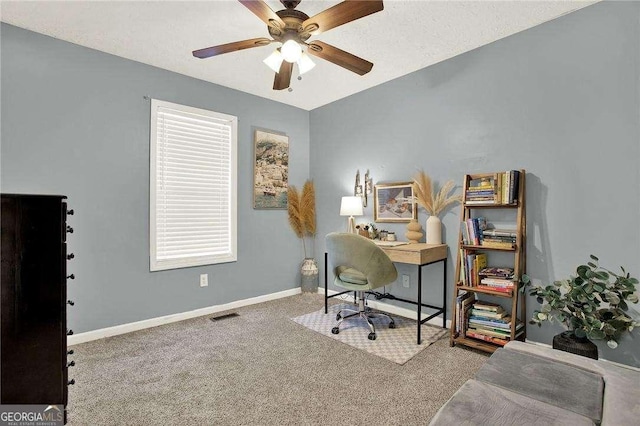 office space with ceiling fan and carpet floors