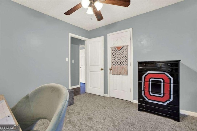 interior space featuring ceiling fan