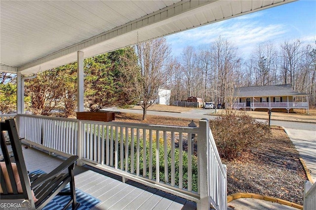 wooden terrace with covered porch