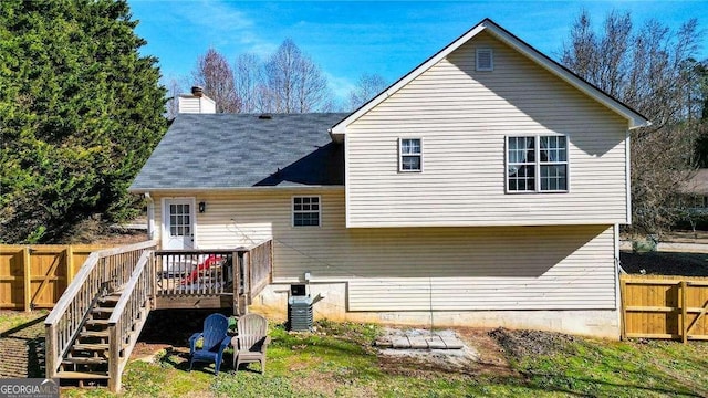 rear view of property with a deck