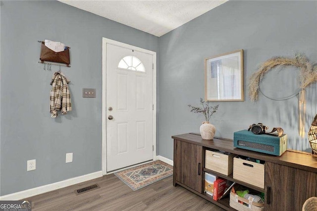 foyer featuring hardwood / wood-style floors