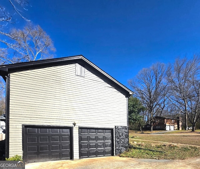 view of side of property featuring a garage