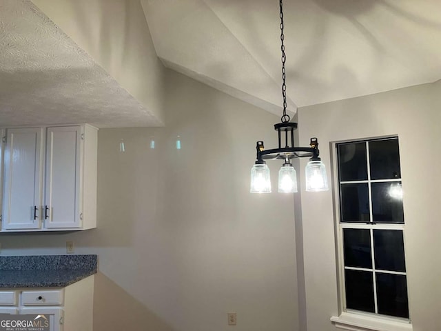 interior details featuring a textured ceiling