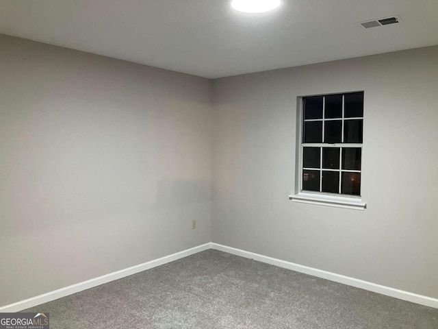 spare room with carpet