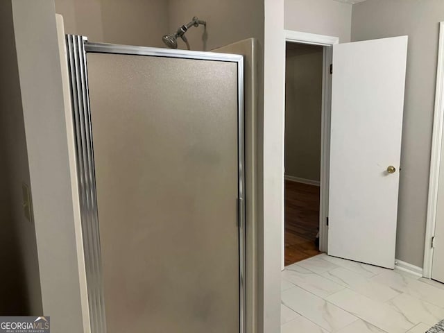 bathroom with an enclosed shower